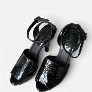 CHANEL Glossy Black Heels with Logo Detail
